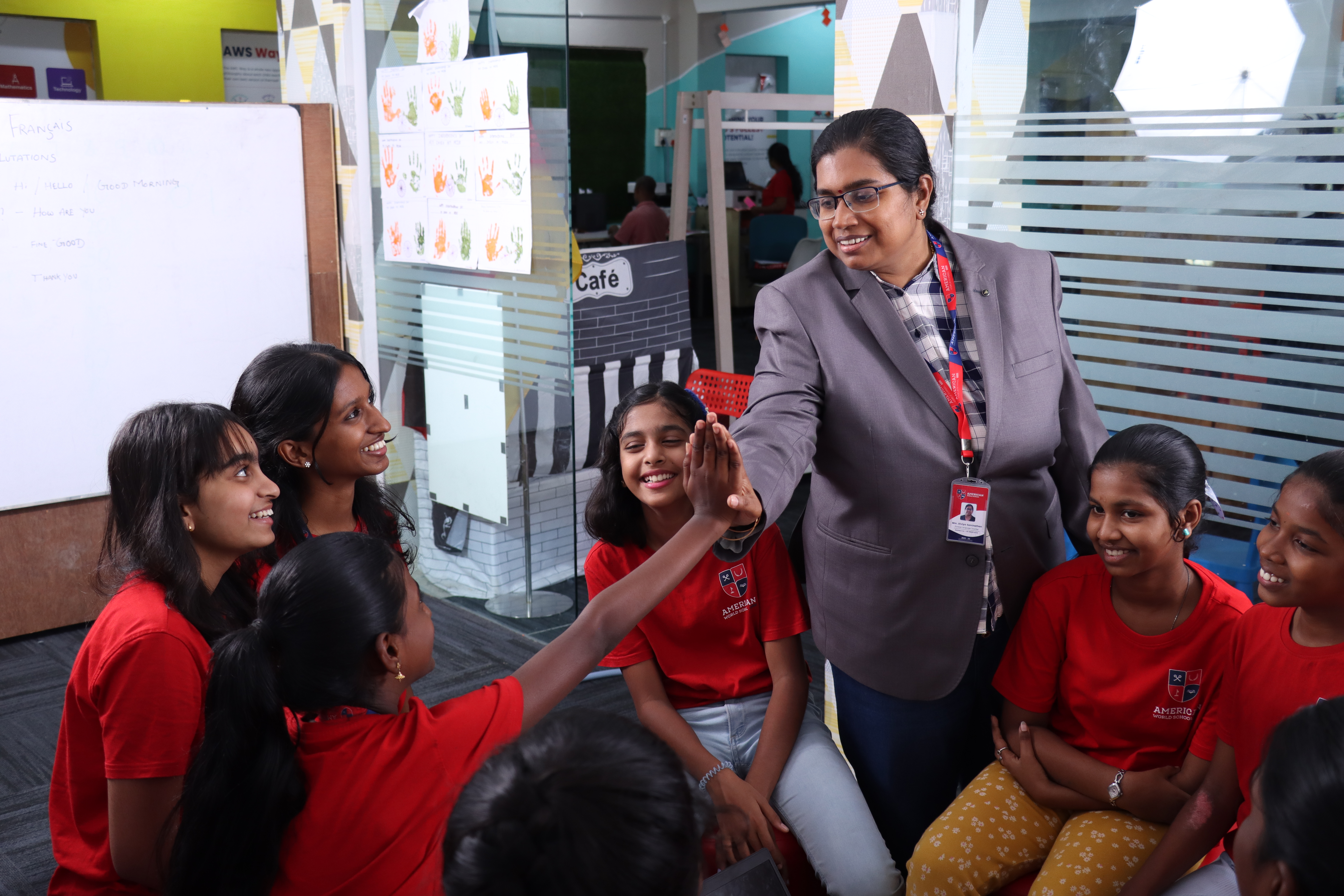 AWS teacher and joyful students during a classroom tour
