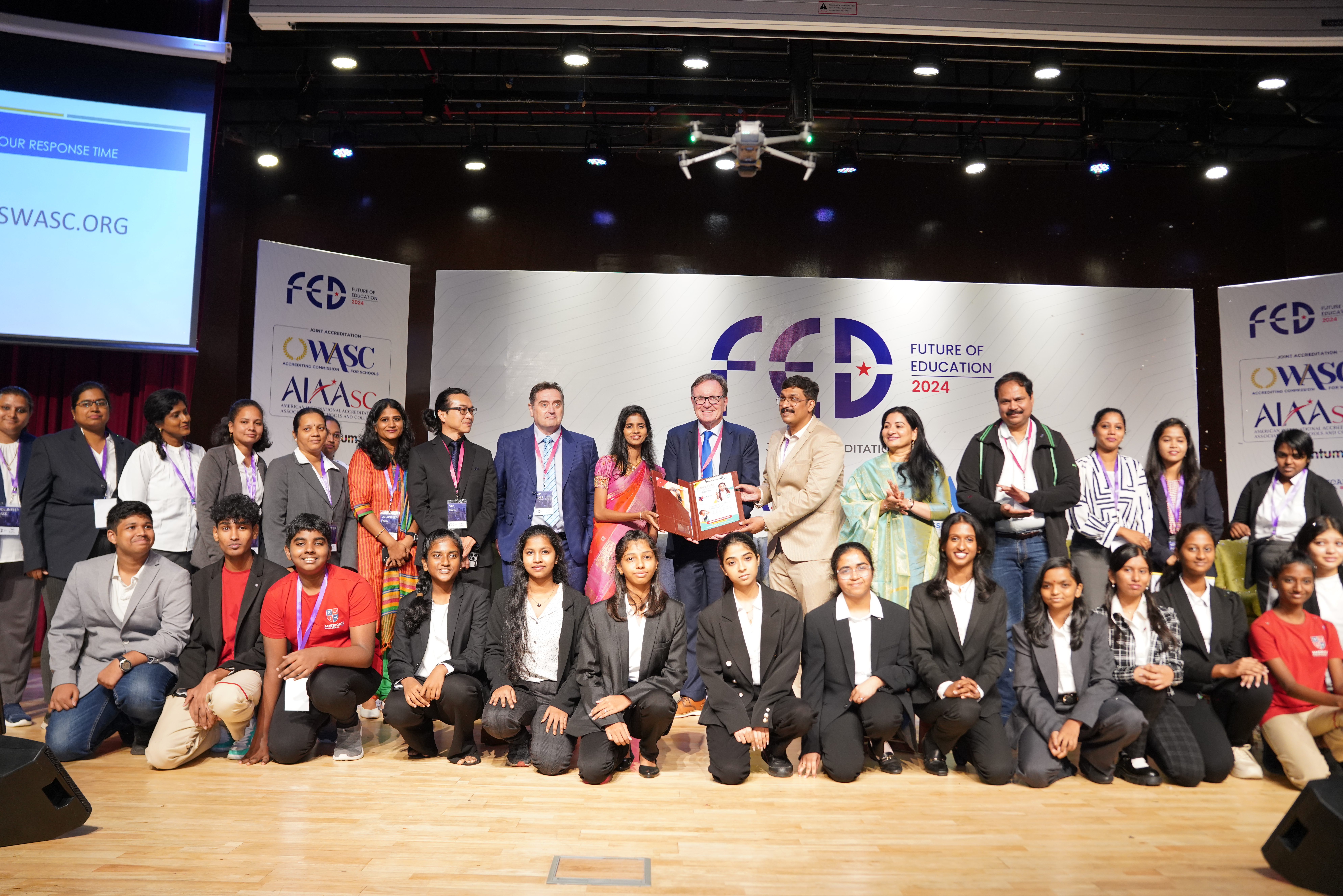 Founder Dr. Mohana Lakshmi on the FED 2024 stage with WASC and Edmentum banners