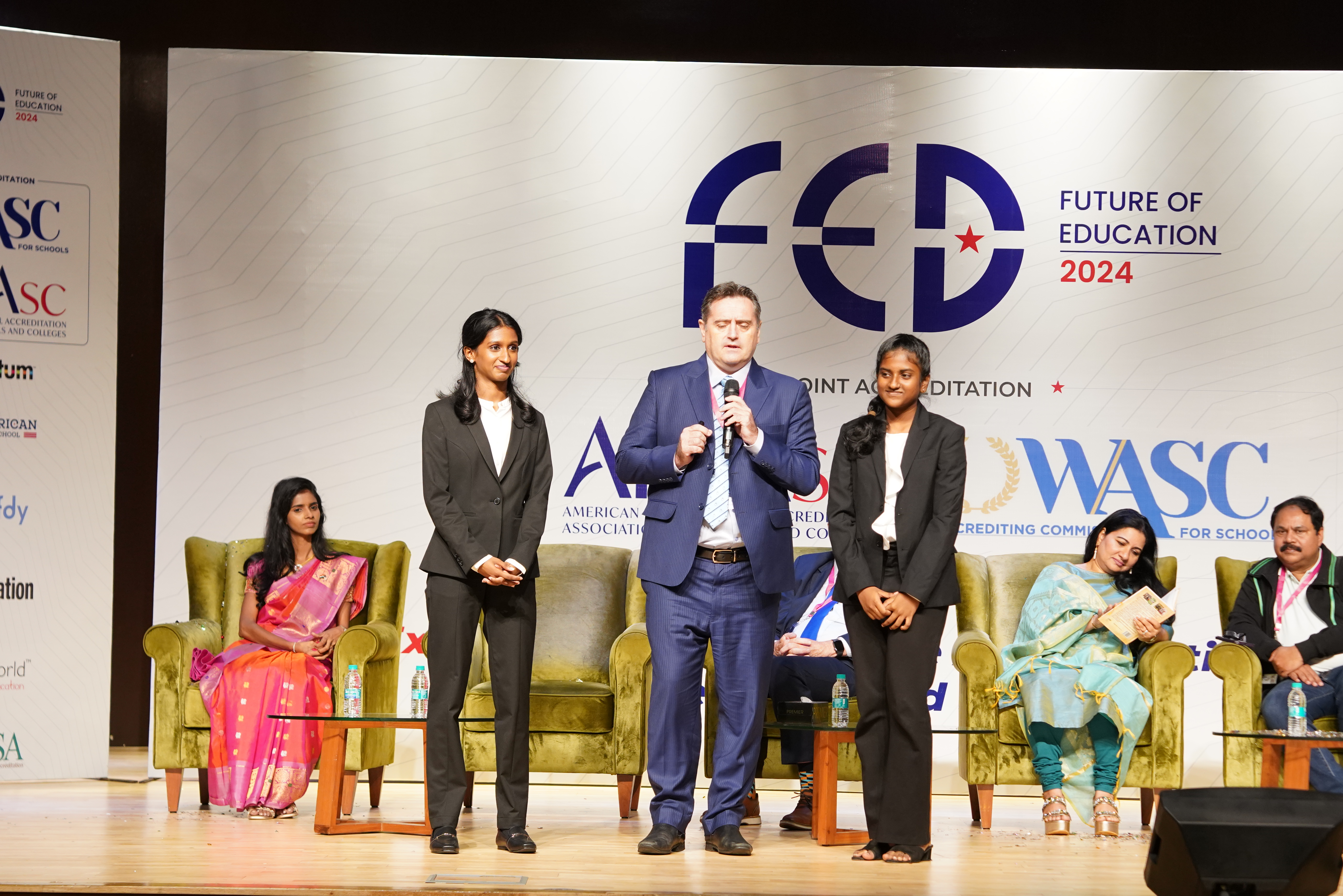 Founder Dr. Mohana Lakshmi on stage at FED 2024 with global education leaders
