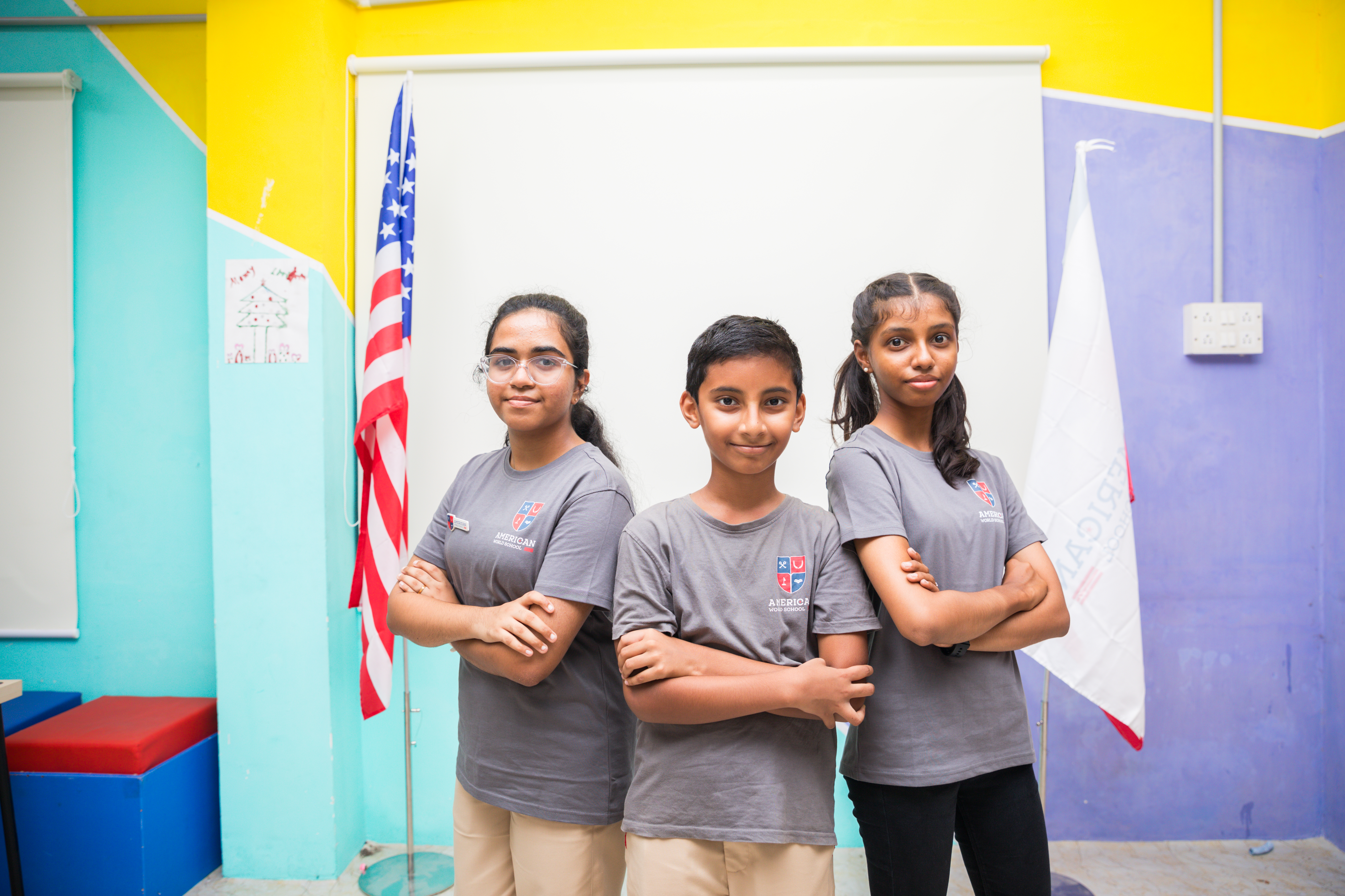 AWS students standing proudly with the US flag